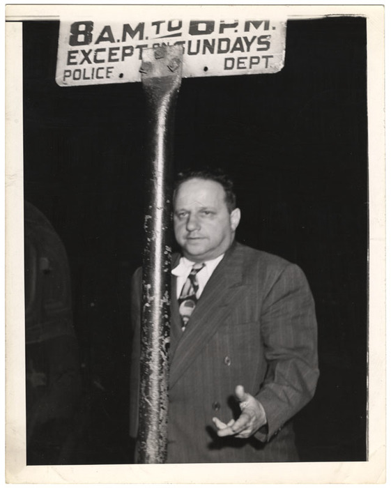 Man and police department sign
