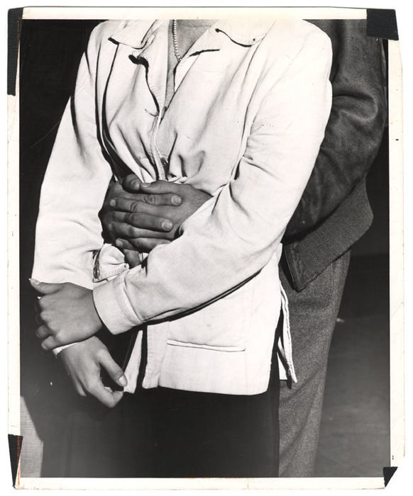 Man's arms around a woman's waist