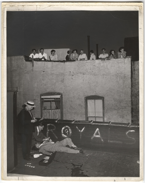[Bystanders watching police take fingerprints from murder victim Joseph Gallichio, found next to his pigeon cote, New York]