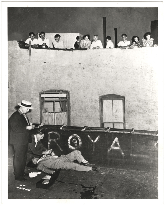 [Bystanders watching police take fingerprints from murder victim Joseph Gallichio, found next to his pigeon cote, New York]
