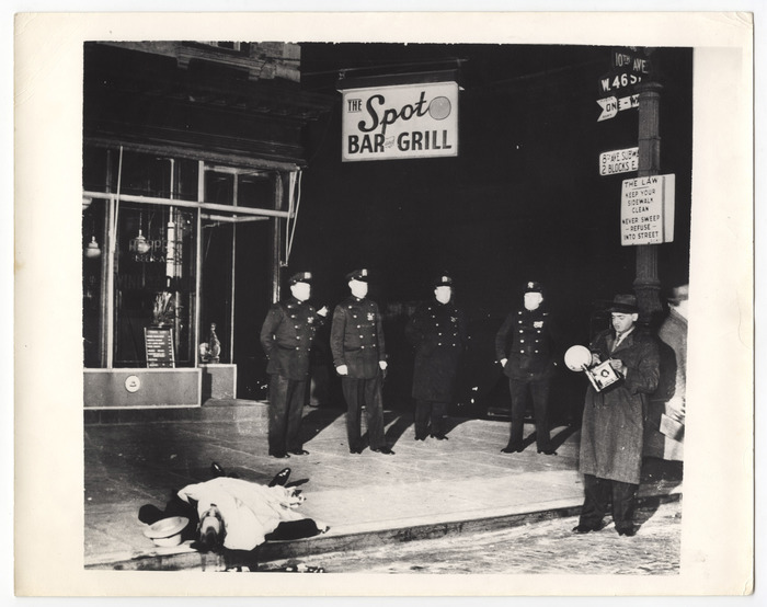 [Weegee and police with body of longshoreman David “the Beetle” Beadle outside the Spot Bar and Grill, New York]