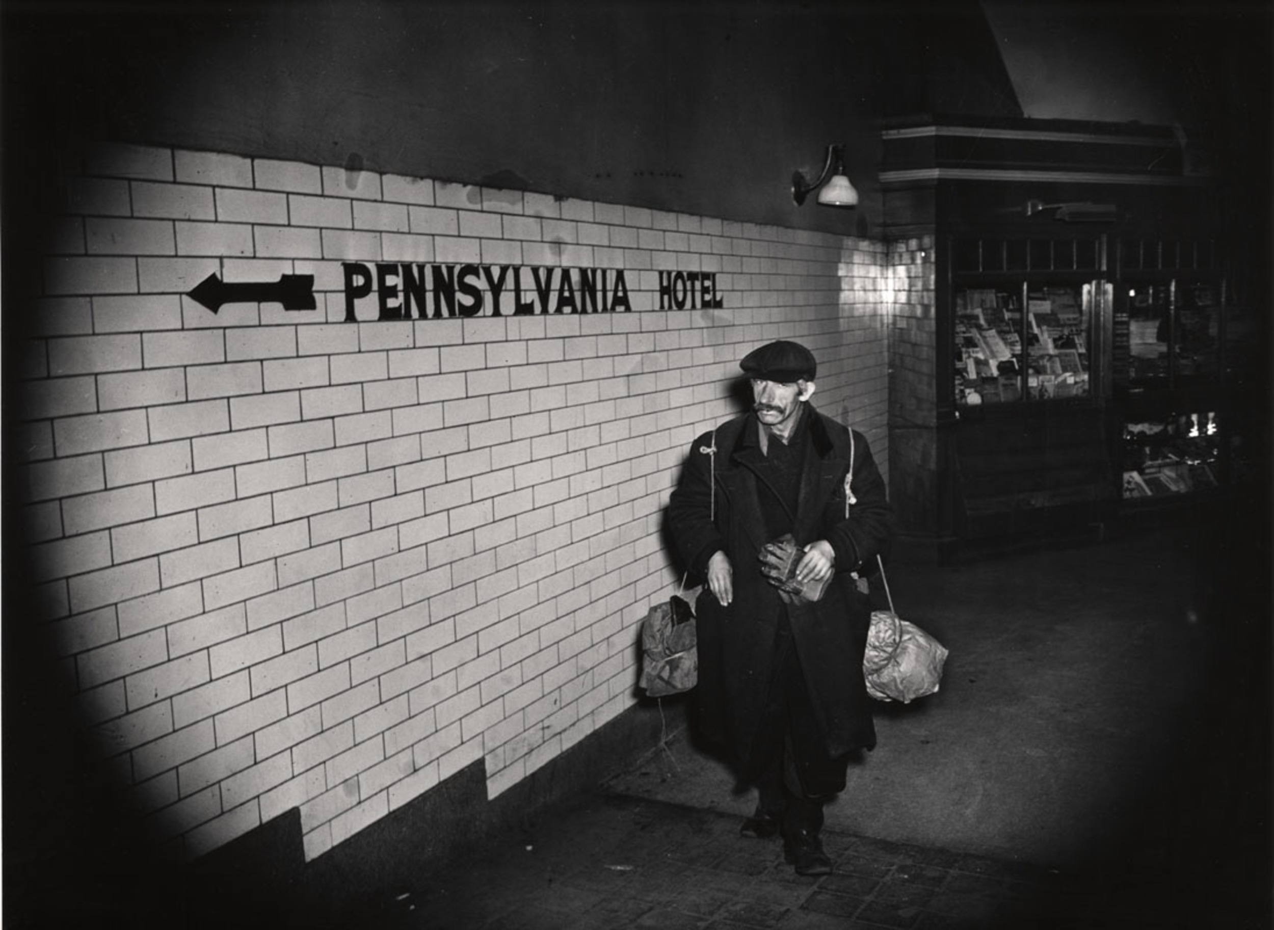 [Homeless man in underground passage, New York] International Center