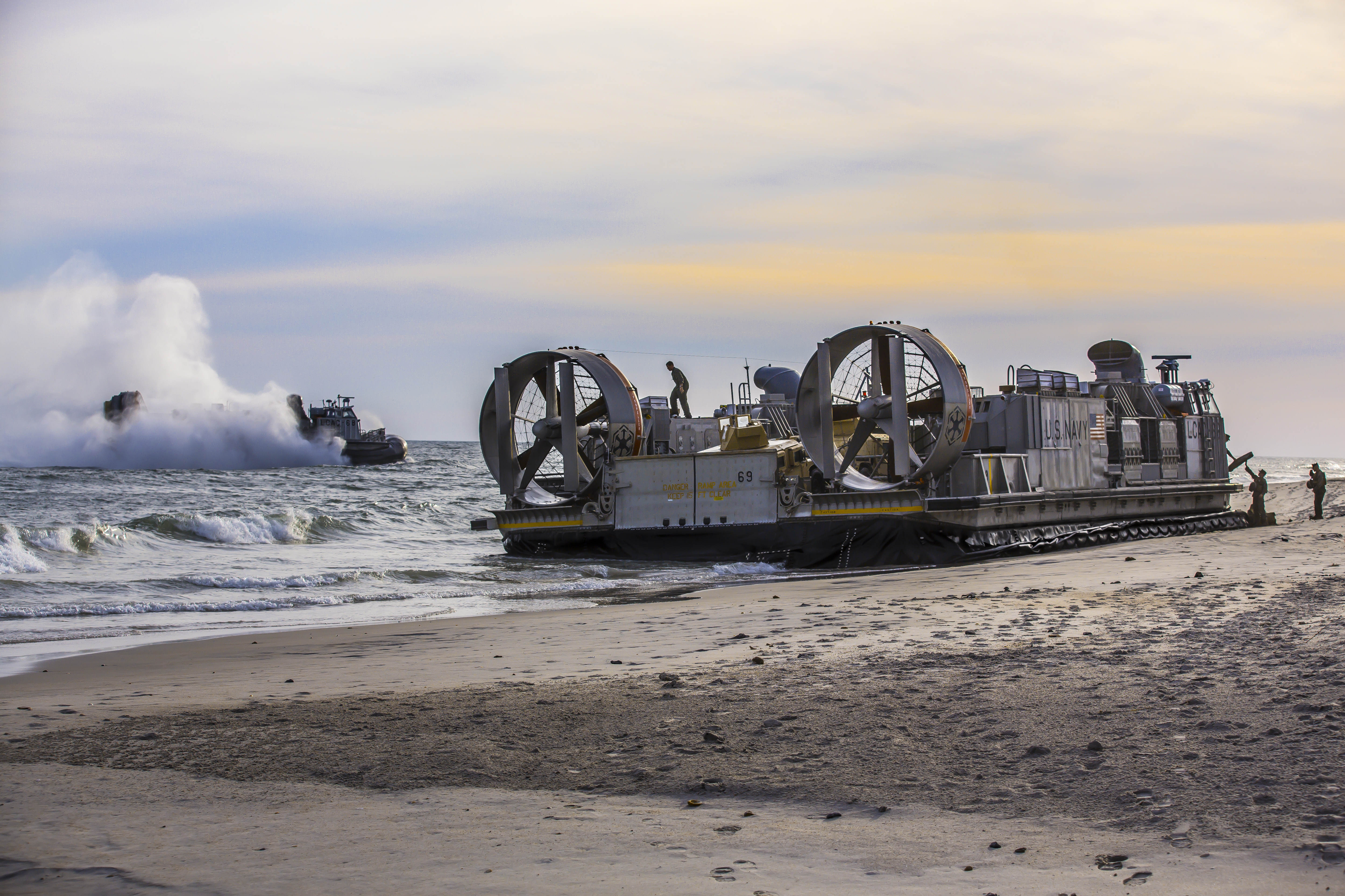 CAMP LE JEUNE, N.C. (Nov. 4, 2014) Marines disembark landing craft air cushion (LCAC) vehicles at Camp Le Jeune, N.C. during the multinational exercise Bold Alligator 2014. Bold Alligator is intended to improve Navy and Marine Corps amphibious core competencies. Working with coalition, NATO, allied and partner nations is a necessary investment in the current and future readiness of our forces. The exercise takes place Oct. 29 - Nov. 10, 2014, afloat and ashore along the Eastern seaboard. #BoldAlligator14 (U.S. Navy photo by Mass Communication Specialist 2nd Class Corbin J. Shea/Released)