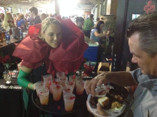 A server in a rose costume offered Four Roses Bourbon's Rose-a-rita, which won an award at Taste of the Bluegrass. JANET PATTON — Herald-Leader