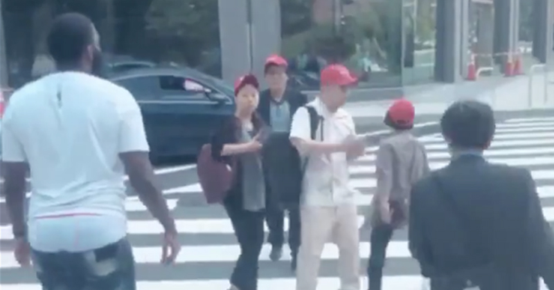 Racist Attack? Black Man Takes MAGA Hats From Group of Asians