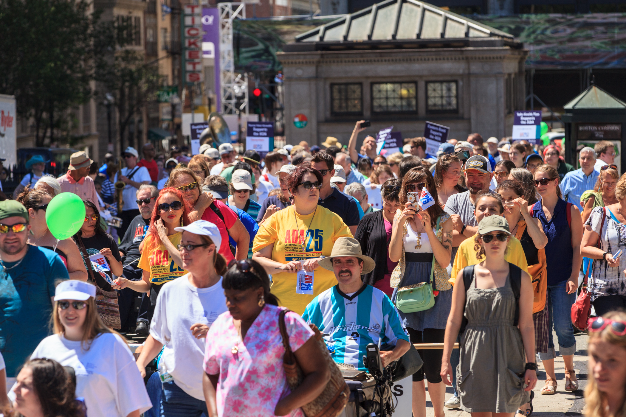 people attending ADA 25 event march