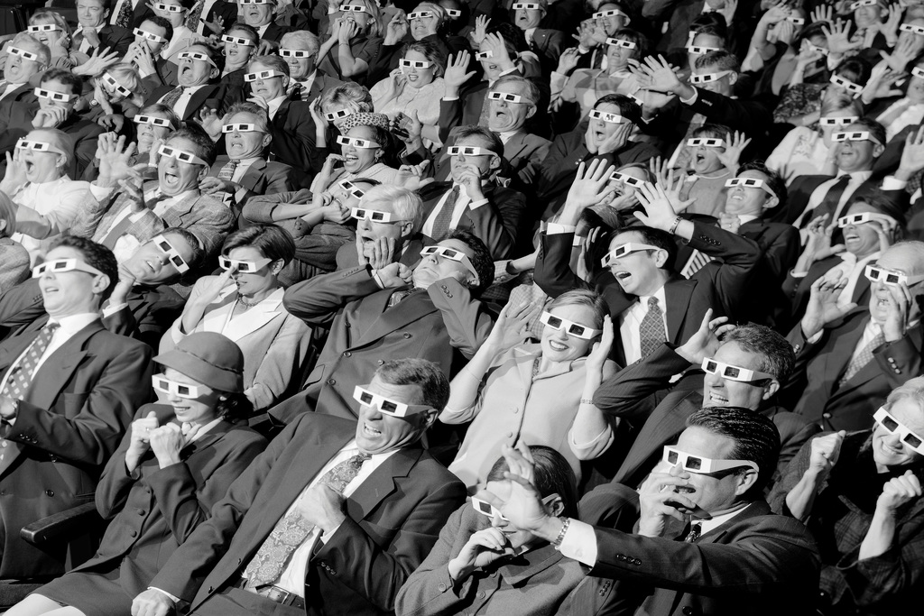 3D Movie Viewers in Theater Wearing 3D Glasses Poster 18x12