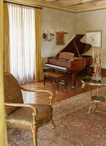 The Steinway piano in the living room of the Girardi Residence.