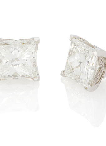 Lot 30: A pair of Princess-Cut diamond stud earrings $312,500