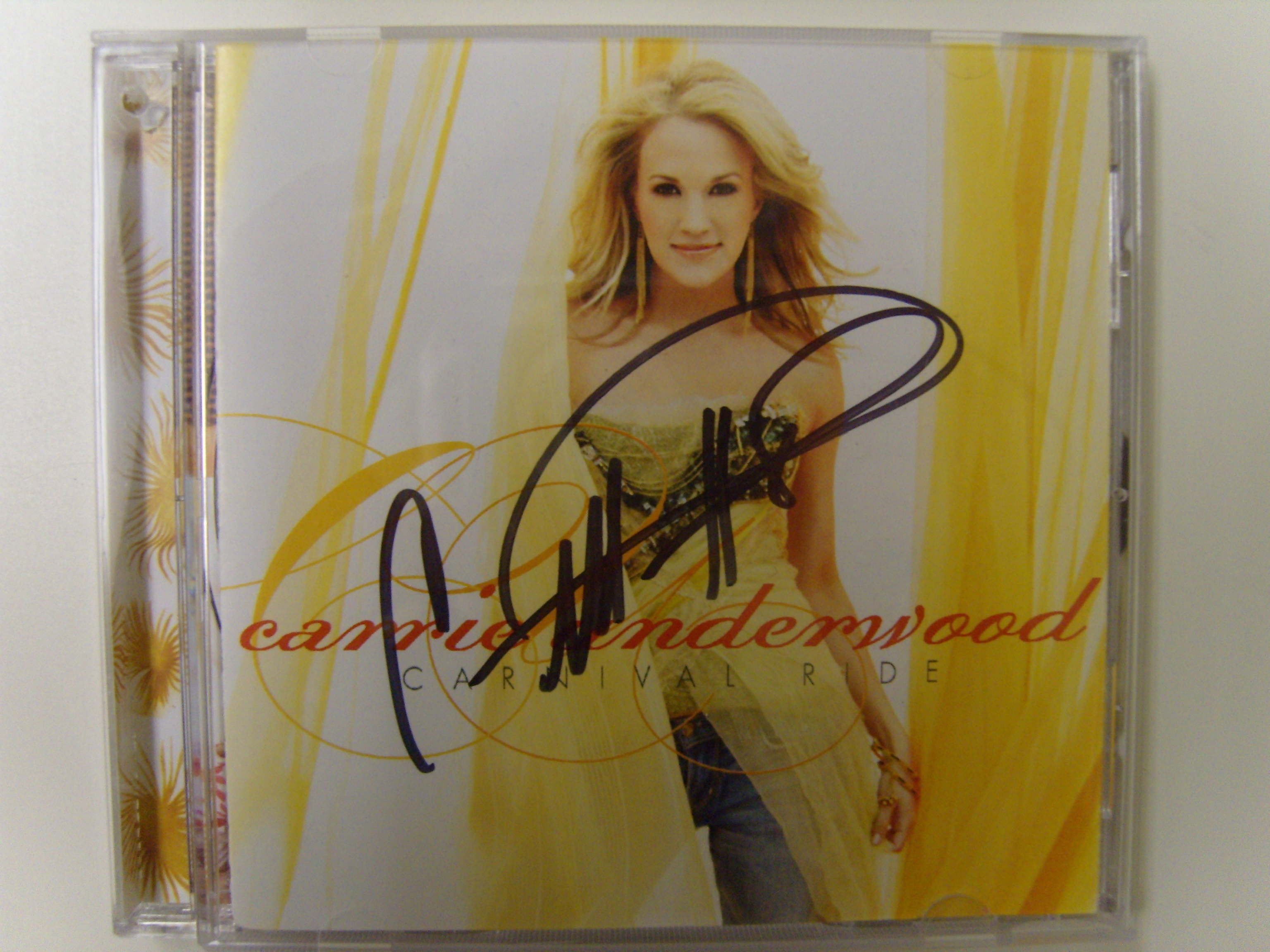 Charitybuzz: Signed Carrie Underwood CD & Poster - Lot 114030