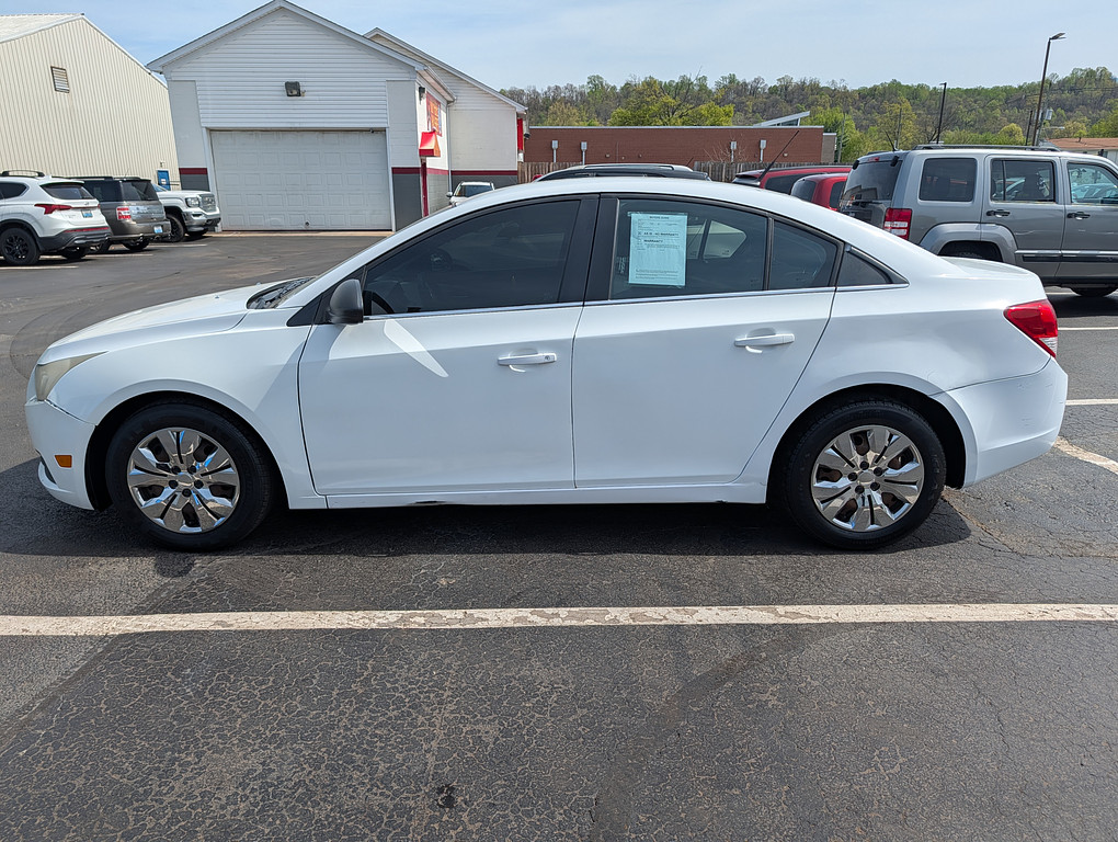 2012 Chevrolet CRUZE Located at Circus Auto Sales slide-image