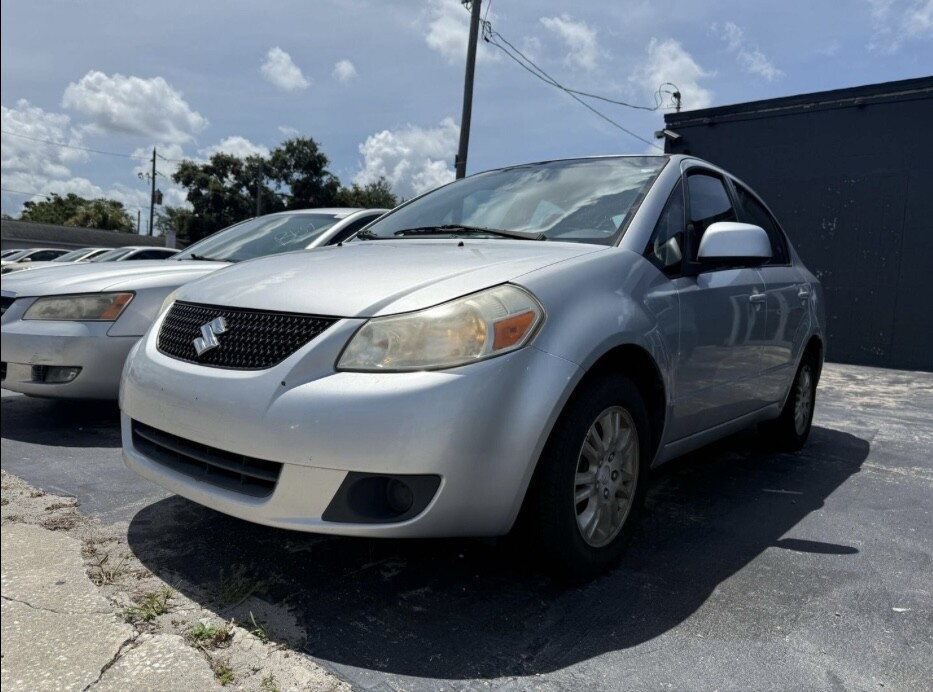 2012 Suzuki SX4 Located at Drive Smart slide-image