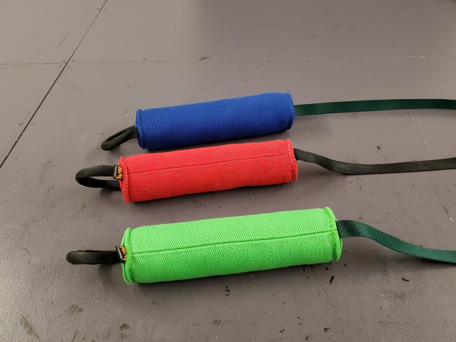 Round Pillow with tubular Handle and line.