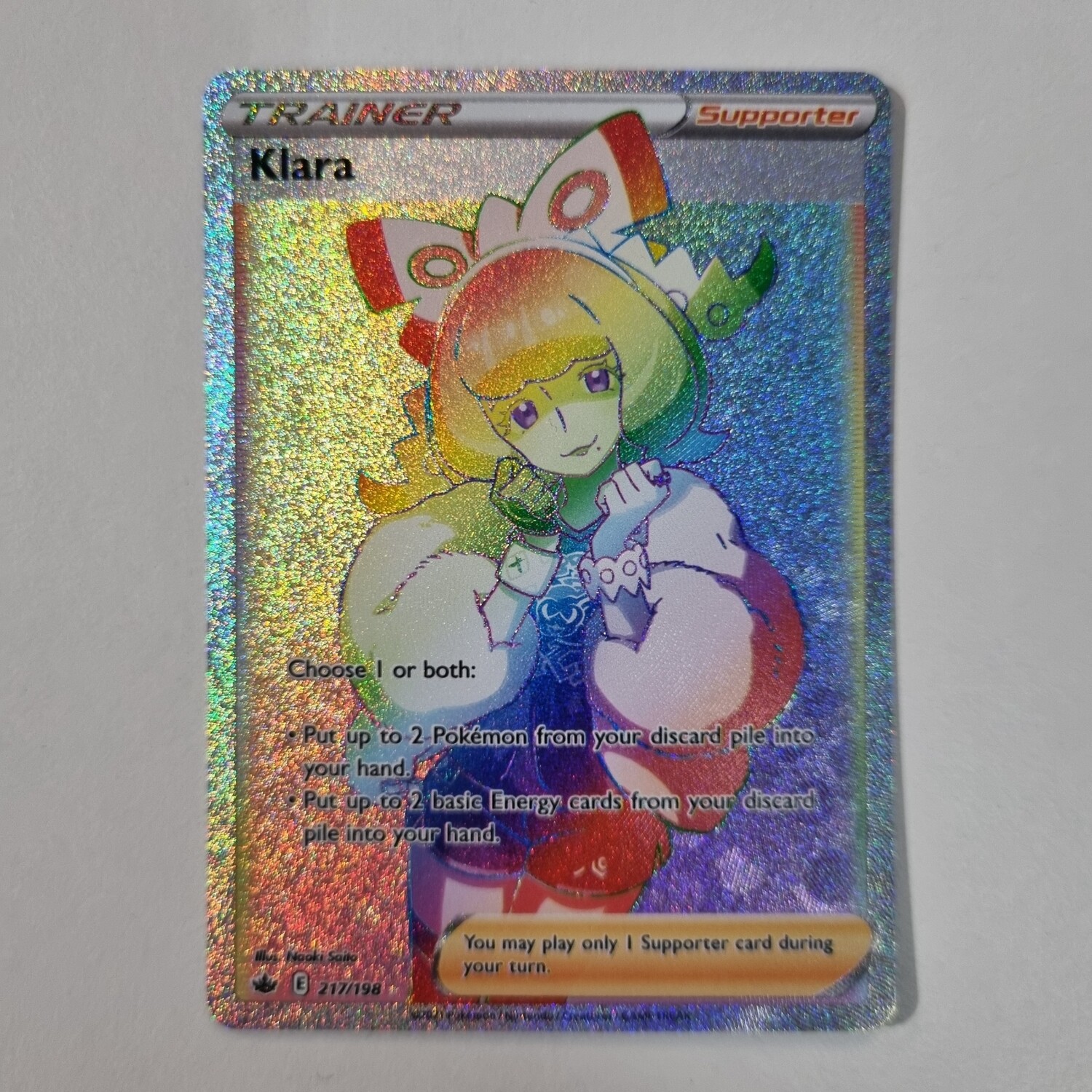 Pokemon Card Klara Trainer Rainbow Secret Rare 217/198