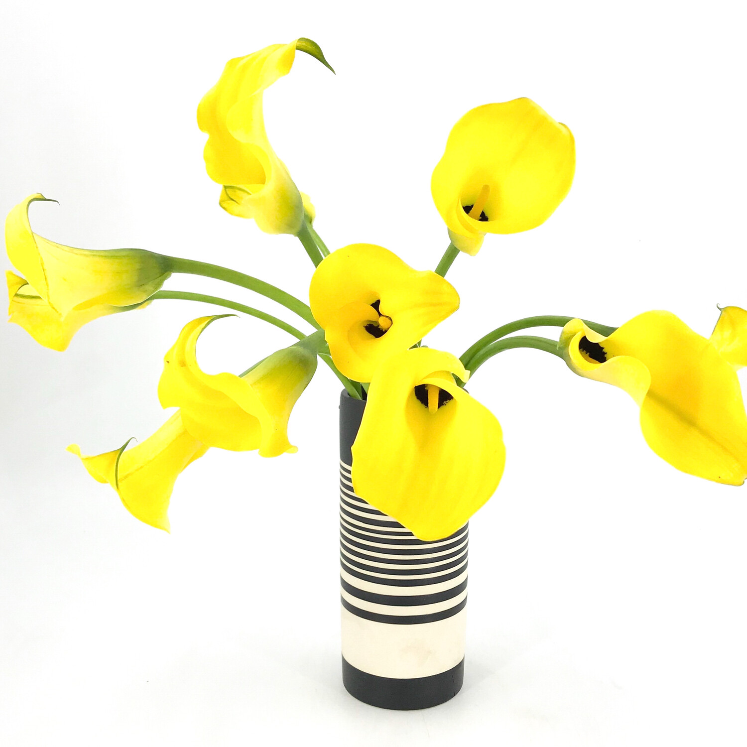 LOCAL CALLA LILIES IN STONEWARE VASE