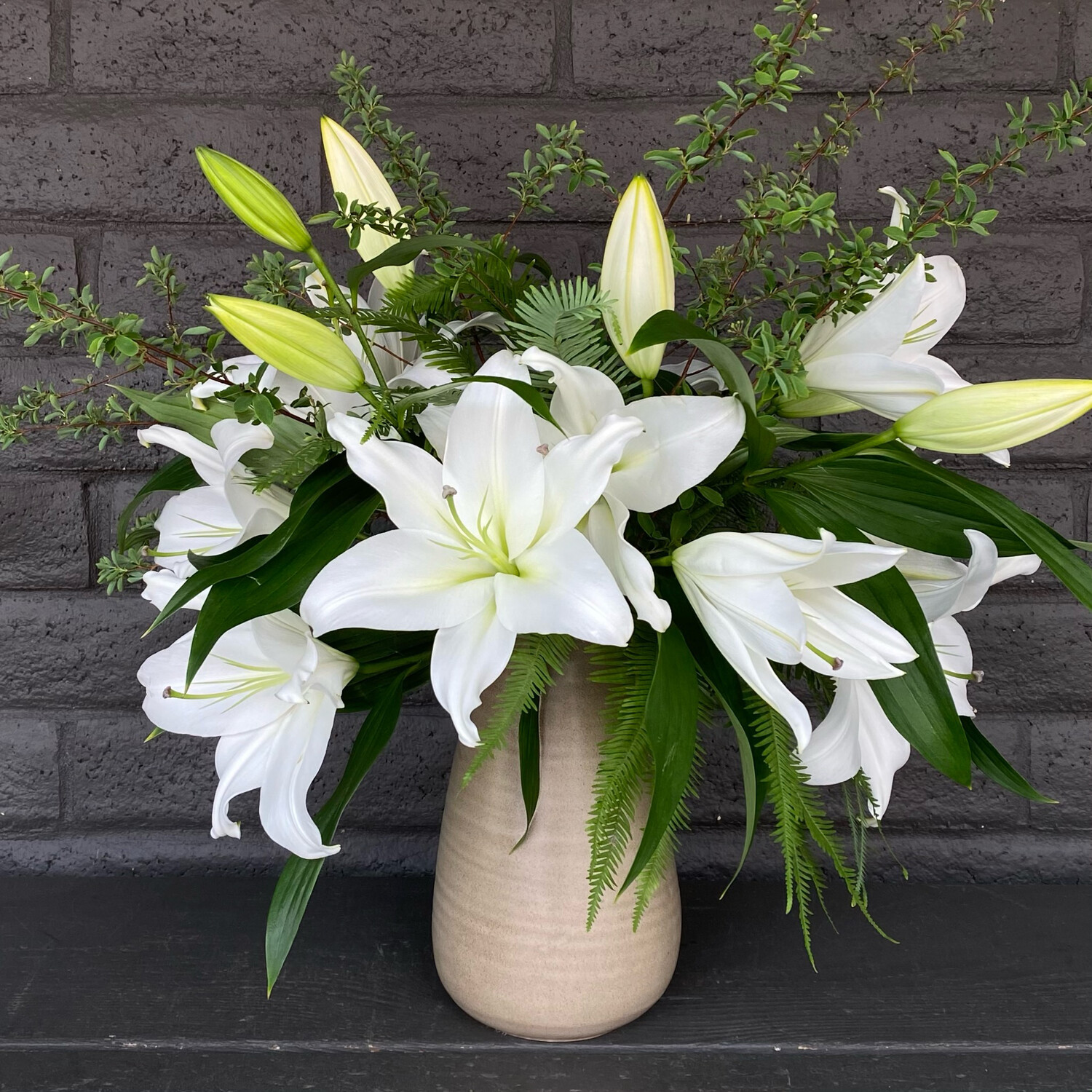 LILIES IN CERAMIC VASE