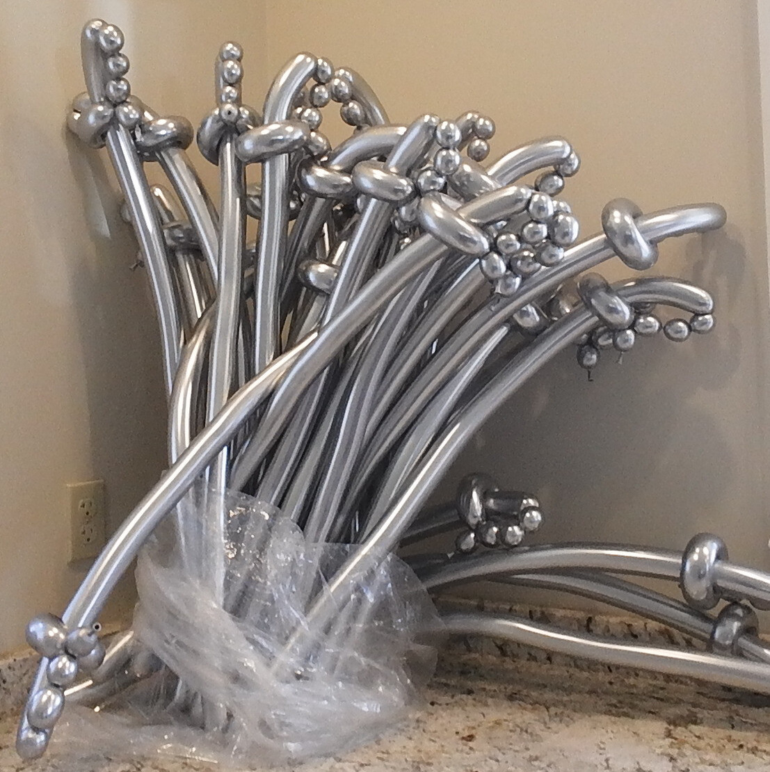 1 Balloon swords that look like silver or gold