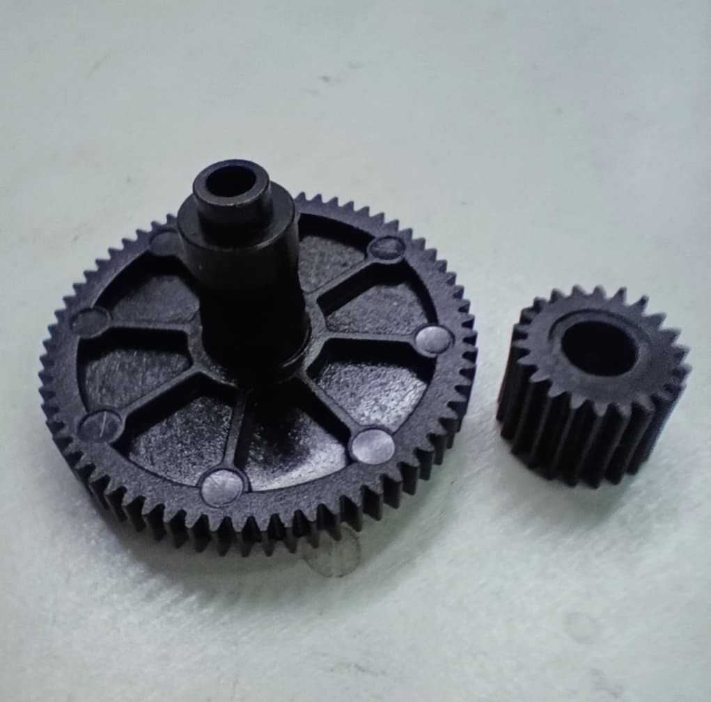 Titan extruder large & small gear wheels.
