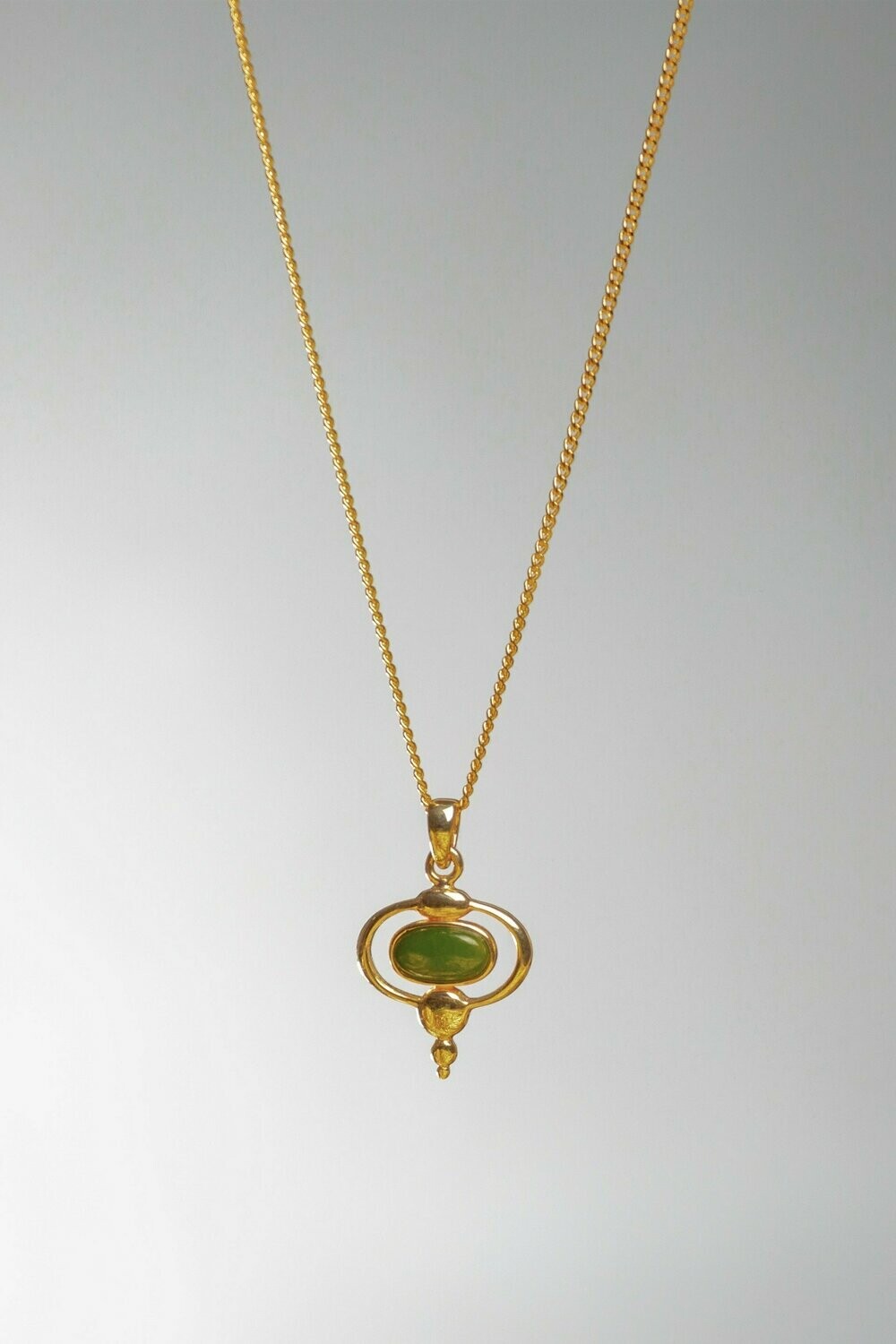 Moko Pounamu Contemporary Oval Greenstone and 9ct Gold Pendant