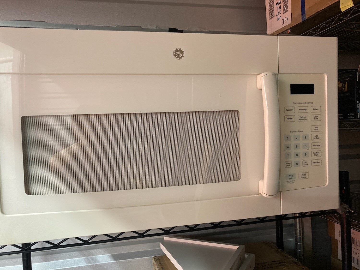 GE offwhite aboverange Microwave 2014 2314