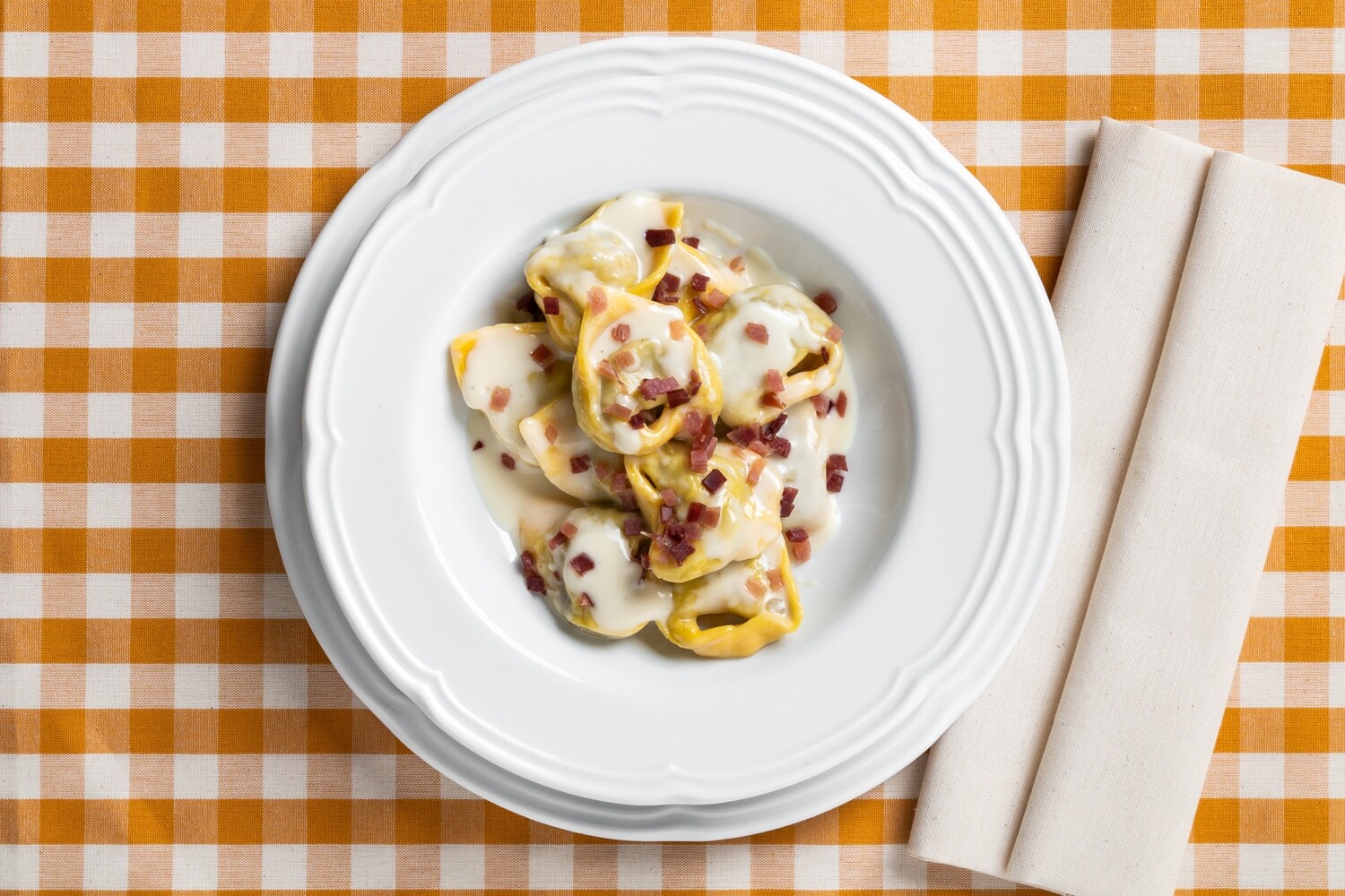 Tortelli ai porcini in crema di parmigiano e fiocco Ciapa e porta a