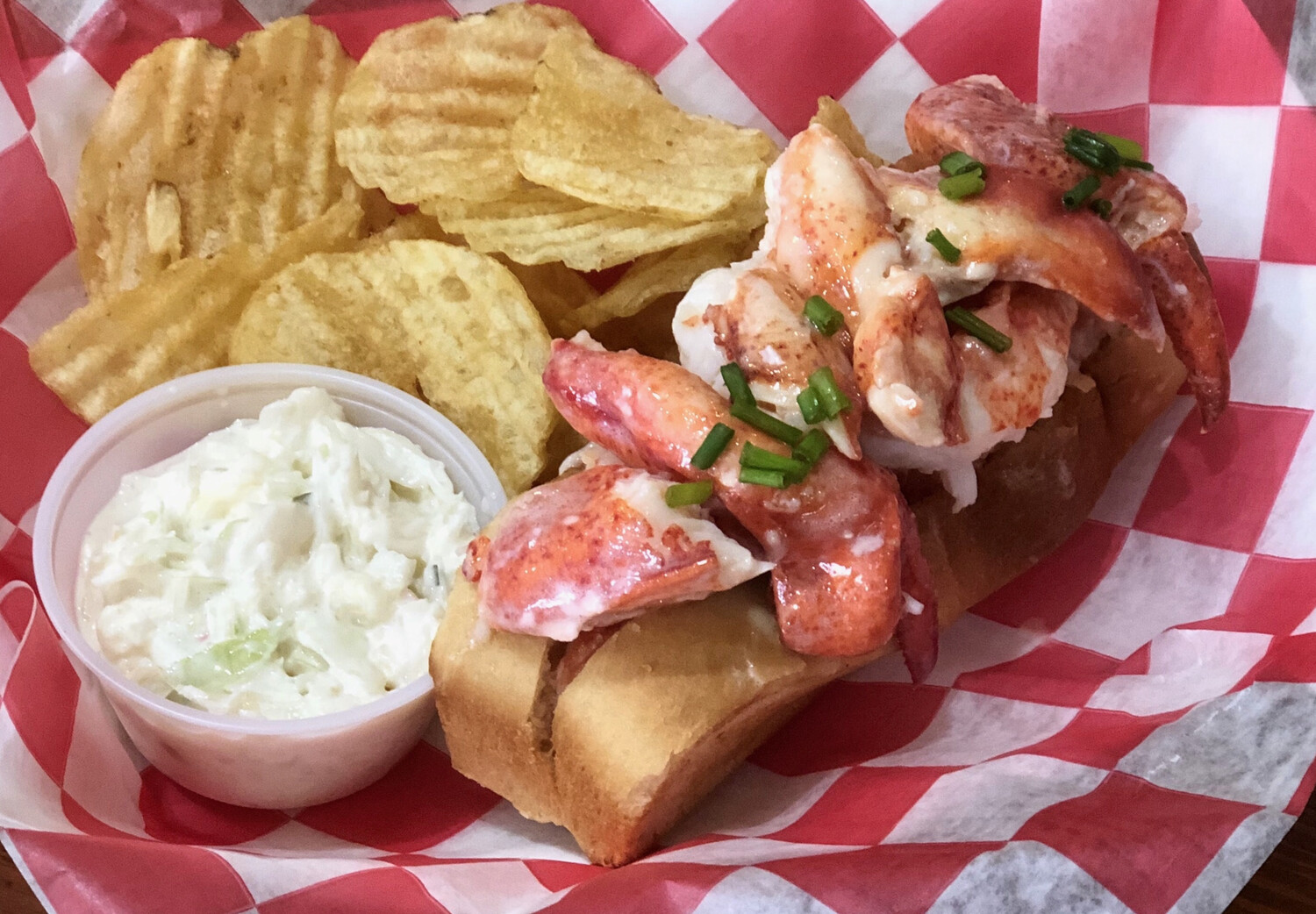 HOLO Connecticut Style Lobster Roll served warm with drawn butter