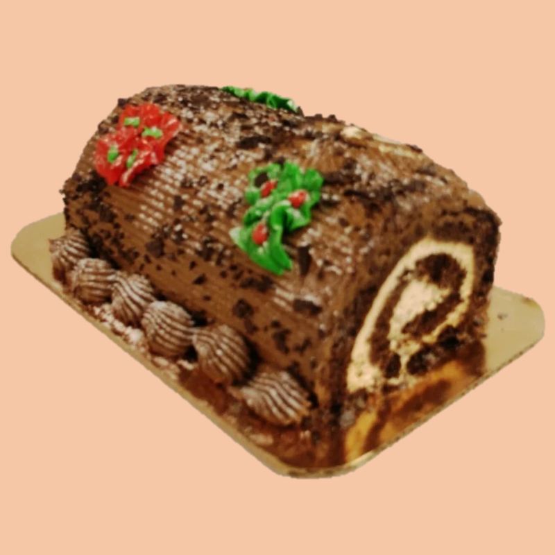 Chocolate yule log cake showing a swirl design inside.