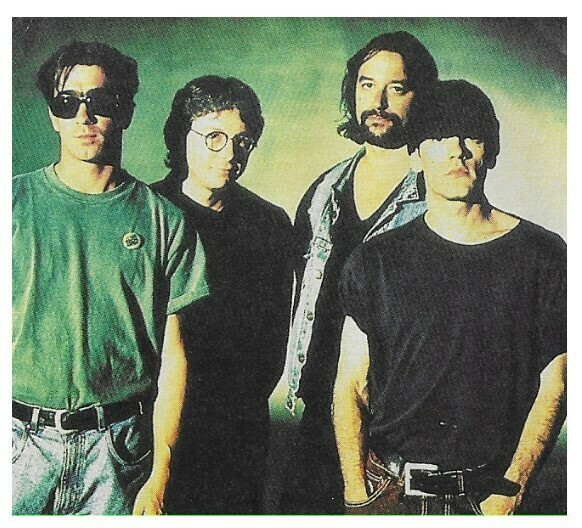 R.E.M. / Group PhotoMichael On RightGreen Background Magazine Photo 1992
