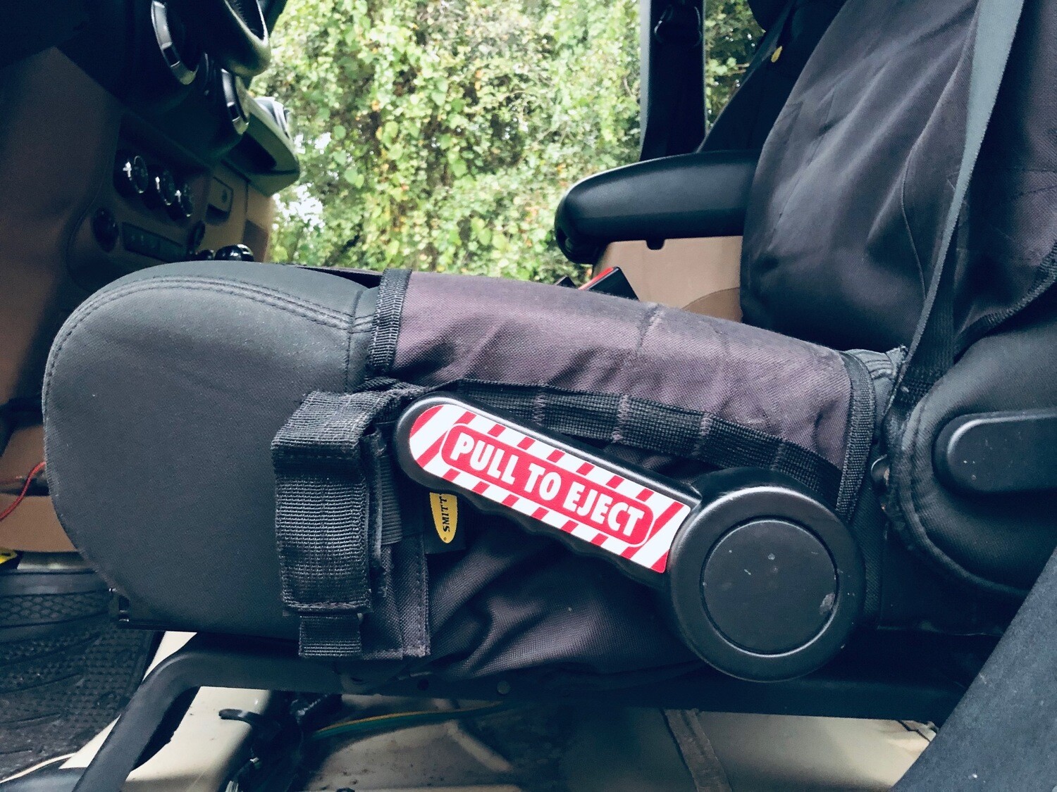 Pull to Eject seat handle