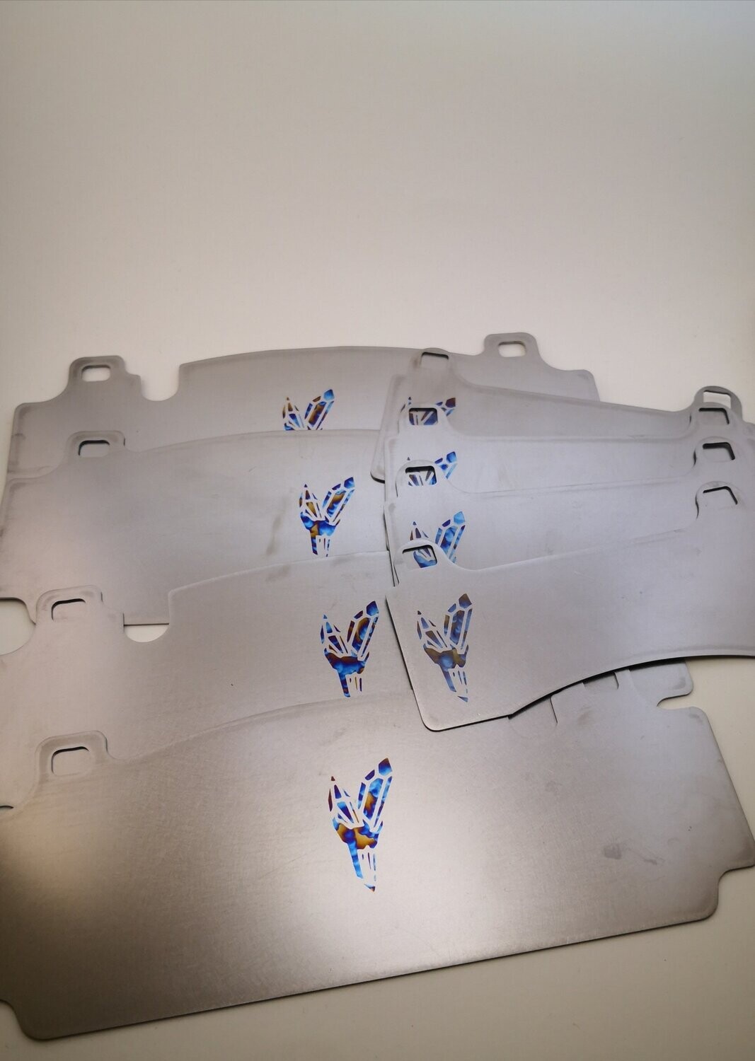 Titanium brake pad shims for BMW F80 M3, F82 M4 carbon setup