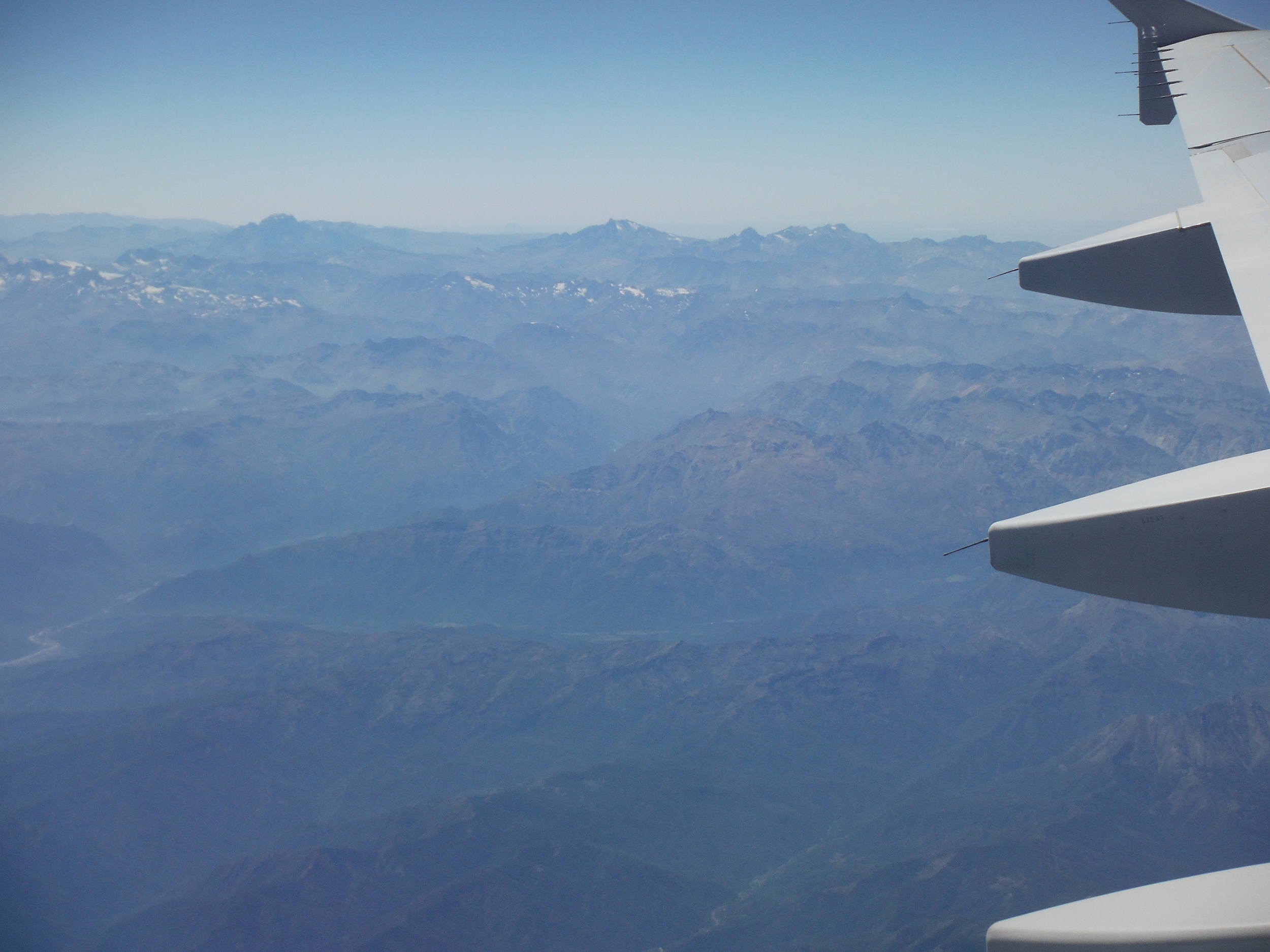 Airplane over mountains