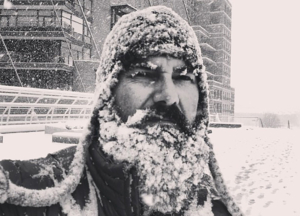man with ice beard in black and white