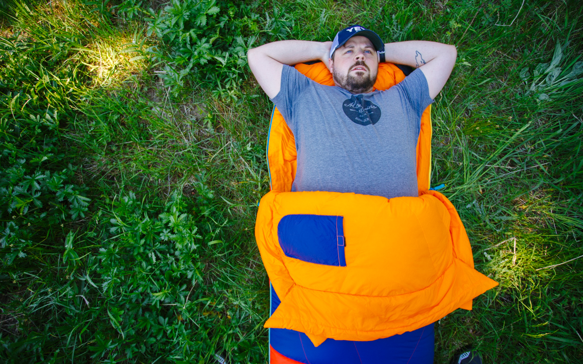 person laying in sueno sleeping bag