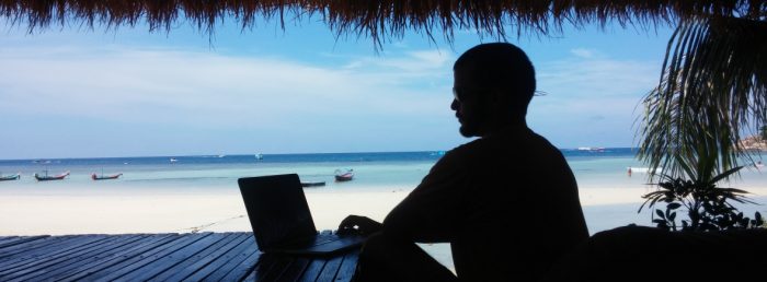 Mobile Office. Working on Beach