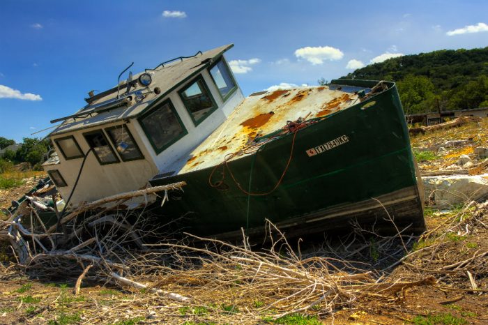 A vessel left beached after a 2011 drought in Texas's Lake Travis, part of the Colorado River. Photo by Erik A. Ellison
