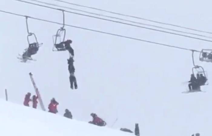 skier-hanging-from-chairlift