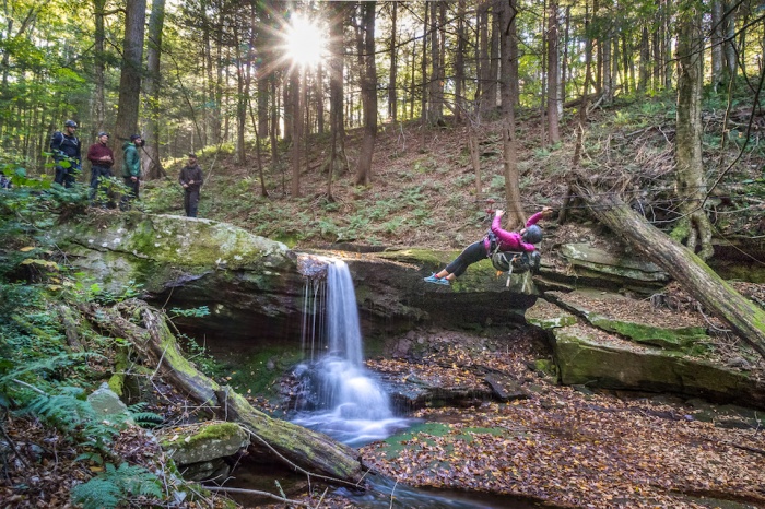 Writer Mallory Paige on a tyrolean traverse at survival academy
