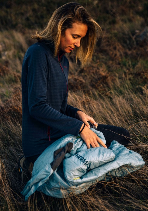 therm-a-rest space cowboy packed woman camping