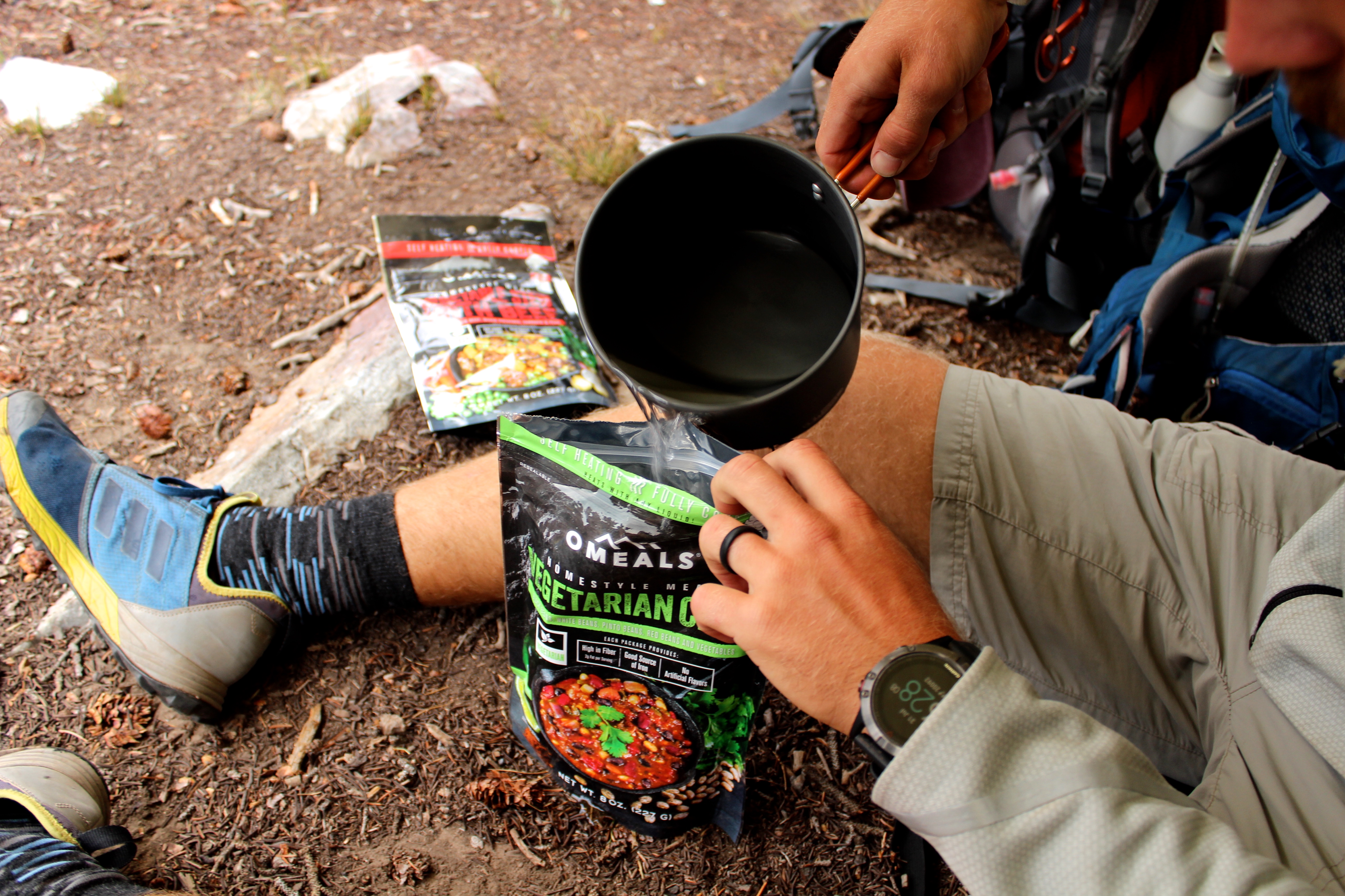 pouring water into Omeals bag