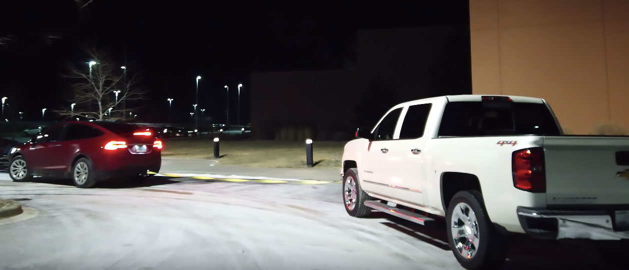 Fed Up: Tesla Sedan Muscles Chevy Truck Out of Charging Station