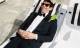 Alex Honnold lounging beach chair in a tux