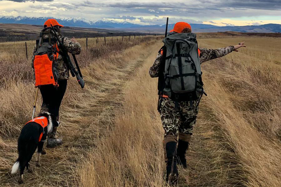 Author walking while wearing Muck Arctic Hunter Tall Boots Author walking while wearing Muck Arctic Hunter Tall Boots