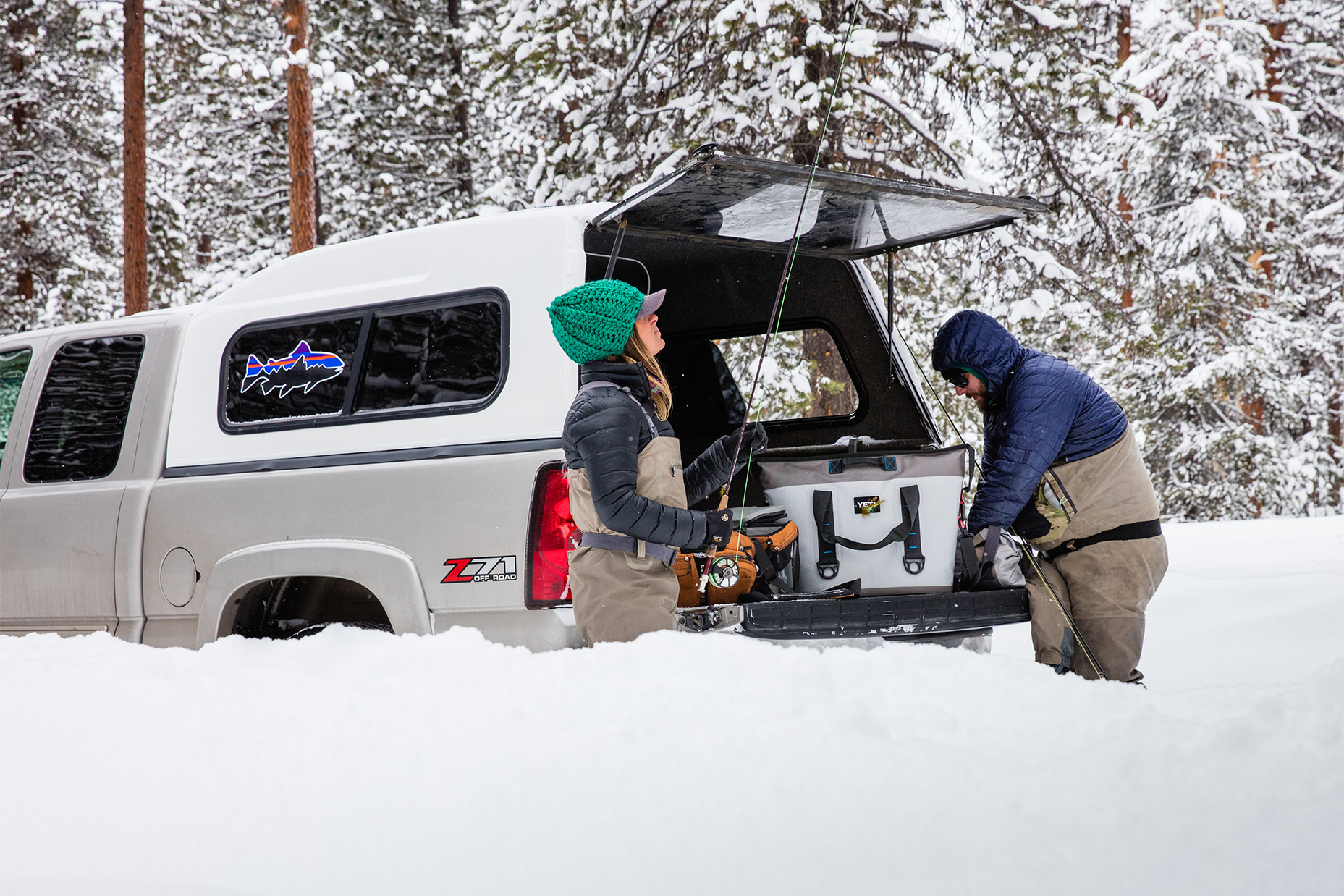 Campers unload their YETI cooler and other gear