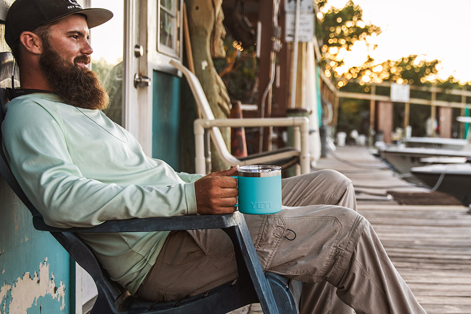 Man using YETI Reef Blue Rambler Mug