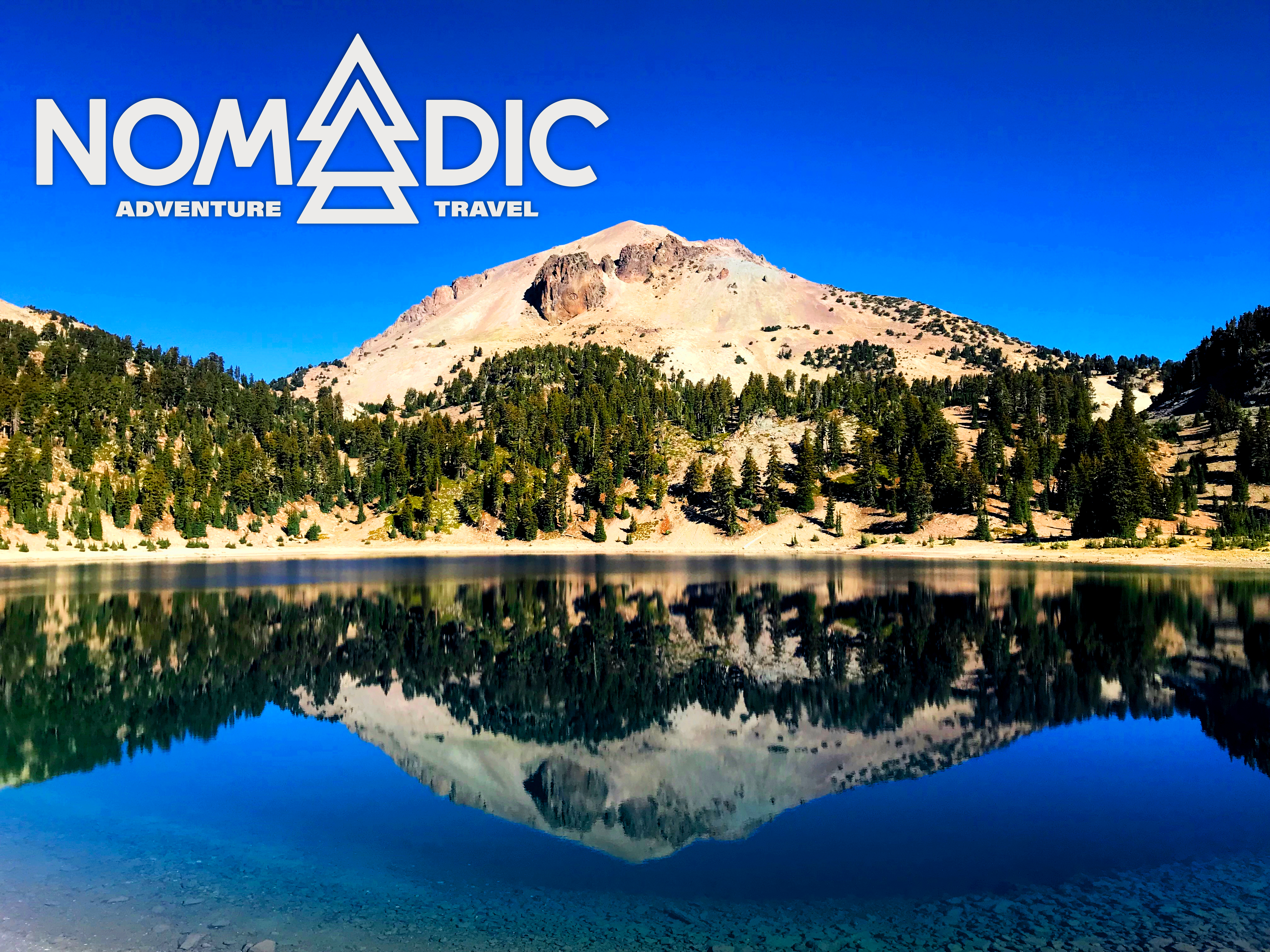 Lassen Peak with Nomadic Adevnture & Travel Logo