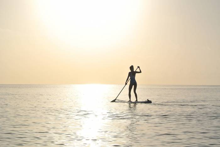 paddleboard sunrise water