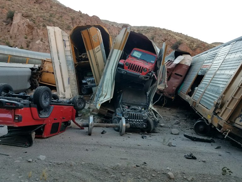 Pile of Jeep Pickups Tumble Off Derailed Train