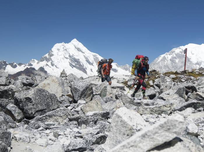 Marek Holocek hiking over boulder field