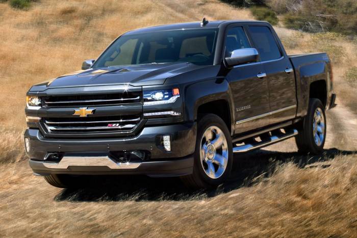 Chevy Silverado driving fast through field