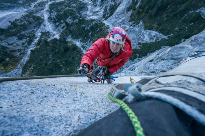 camera looking down at Savannah Cummins aid climbing
